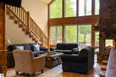 Stunning, custom-built log home overlooking the 16th tee & on Cedar River Golf Course in Michigan - for sale on GolfHomes.com, golf home, golf lot