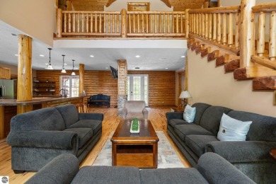 Stunning, custom-built log home overlooking the 16th tee & on Cedar River Golf Course in Michigan - for sale on GolfHomes.com, golf home, golf lot