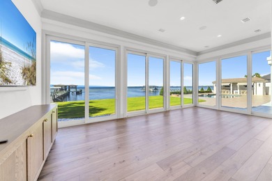 Welcome to 6 Sunset Beach Place, an extraordinary bay front on Golf Club at Bluewater Bay Resort in Florida - for sale on GolfHomes.com, golf home, golf lot