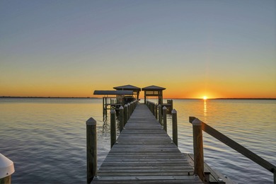 Welcome to 6 Sunset Beach Place, an extraordinary bay front on Golf Club at Bluewater Bay Resort in Florida - for sale on GolfHomes.com, golf home, golf lot