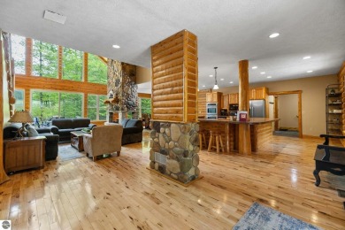 Stunning, custom-built log home overlooking the 16th tee & on Cedar River Golf Course in Michigan - for sale on GolfHomes.com, golf home, golf lot