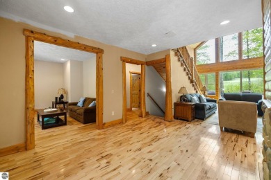 Stunning, custom-built log home overlooking the 16th tee & on Cedar River Golf Course in Michigan - for sale on GolfHomes.com, golf home, golf lot