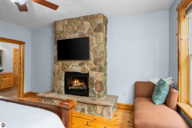 Stunning, custom-built log home overlooking the 16th tee & on Cedar River Golf Course in Michigan - for sale on GolfHomes.com, golf home, golf lot