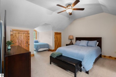 Stunning, custom-built log home overlooking the 16th tee & on Cedar River Golf Course in Michigan - for sale on GolfHomes.com, golf home, golf lot