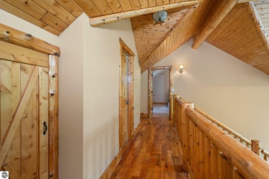 Stunning, custom-built log home overlooking the 16th tee & on Cedar River Golf Course in Michigan - for sale on GolfHomes.com, golf home, golf lot