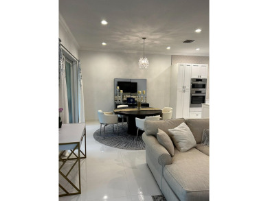 Beautifully renovated and filled with natural light, this bright on Ibis Golf and Country Club in Florida - for sale on GolfHomes.com, golf home, golf lot