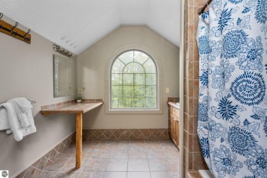 Stunning, custom-built log home overlooking the 16th tee & on Cedar River Golf Course in Michigan - for sale on GolfHomes.com, golf home, golf lot