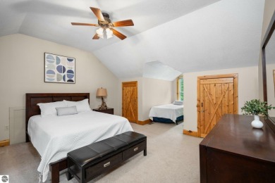 Stunning, custom-built log home overlooking the 16th tee & on Cedar River Golf Course in Michigan - for sale on GolfHomes.com, golf home, golf lot