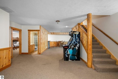 Stunning, custom-built log home overlooking the 16th tee & on Cedar River Golf Course in Michigan - for sale on GolfHomes.com, golf home, golf lot