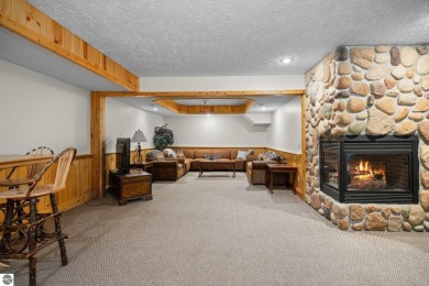Stunning, custom-built log home overlooking the 16th tee & on Cedar River Golf Course in Michigan - for sale on GolfHomes.com, golf home, golf lot