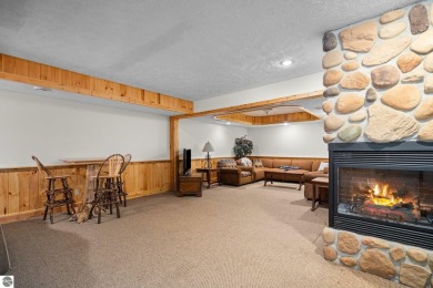 Stunning, custom-built log home overlooking the 16th tee & on Cedar River Golf Course in Michigan - for sale on GolfHomes.com, golf home, golf lot