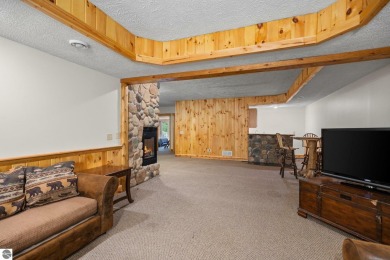 Stunning, custom-built log home overlooking the 16th tee & on Cedar River Golf Course in Michigan - for sale on GolfHomes.com, golf home, golf lot