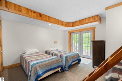 Stunning, custom-built log home overlooking the 16th tee & on Cedar River Golf Course in Michigan - for sale on GolfHomes.com, golf home, golf lot