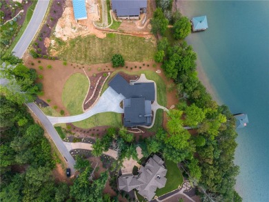 Welcome to an extraordinary lakefront retreat in the prestigious on The Cliffs At Keowee Springs in South Carolina - for sale on GolfHomes.com, golf home, golf lot