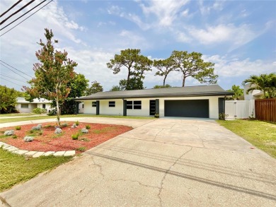 Welcome to your dream home in the heart of Dunedin, one of on The Dunedin Country Club in Florida - for sale on GolfHomes.com, golf home, golf lot