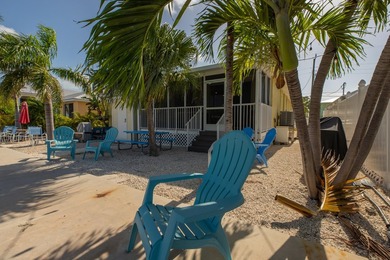 This charming 3-bedroom, 2-bath half-duplex has so much to on Key Colony Beach Golf Course in Florida - for sale on GolfHomes.com, golf home, golf lot