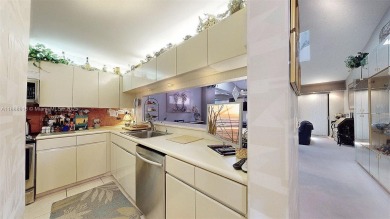 Charming and impeccably maintained 2-bedroom, 2-bath townhouse on Jim McLean Signature Course in Florida - for sale on GolfHomes.com, golf home, golf lot