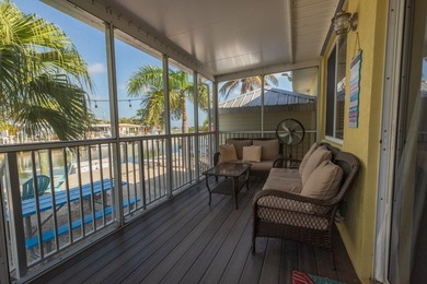 This charming 3-bedroom, 2-bath half-duplex has so much to on Key Colony Beach Golf Course in Florida - for sale on GolfHomes.com, golf home, golf lot