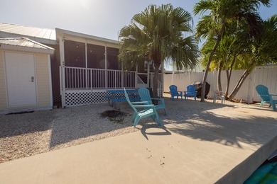 This charming 3-bedroom, 2-bath half-duplex has so much to on Key Colony Beach Golf Course in Florida - for sale on GolfHomes.com, golf home, golf lot