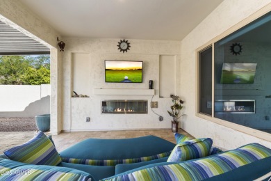 This impeccably maintained residence boasts sophisticated on Tuscany Falls At Pebble Creek in Arizona - for sale on GolfHomes.com, golf home, golf lot