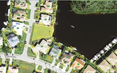 WATERFRONT residential lot located on a quiet dead end street in on Twin Isles Country Club in Florida - for sale on GolfHomes.com, golf home, golf lot