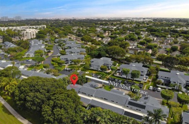 Charming and impeccably maintained 2-bedroom, 2-bath townhouse on Jim McLean Signature Course in Florida - for sale on GolfHomes.com, golf home, golf lot