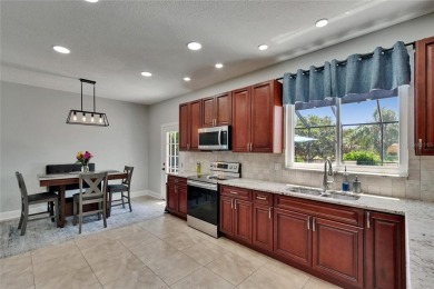 Absolutely gorgeous pool home overlooking a serene pond in the on River Hills Country Club in Florida - for sale on GolfHomes.com, golf home, golf lot