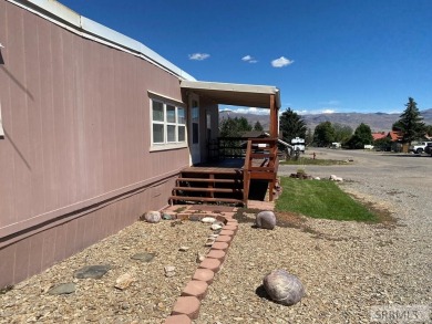 Charming, well-kept home on a nicely landscaped lot in Challis on Challis Golf Course in Idaho - for sale on GolfHomes.com, golf home, golf lot