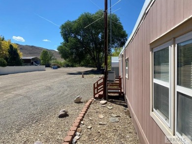 Charming, well-kept home on a nicely landscaped lot in Challis on Challis Golf Course in Idaho - for sale on GolfHomes.com, golf home, golf lot