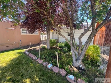 Charming, well-kept home on a nicely landscaped lot in Challis on Challis Golf Course in Idaho - for sale on GolfHomes.com, golf home, golf lot