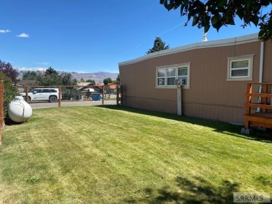 Charming, well-kept home on a nicely landscaped lot in Challis on Challis Golf Course in Idaho - for sale on GolfHomes.com, golf home, golf lot