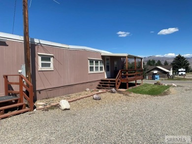 Charming, well-kept home on a nicely landscaped lot in Challis on Challis Golf Course in Idaho - for sale on GolfHomes.com, golf home, golf lot