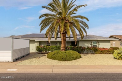 Energy-efficient home in Sun City showcases a large front yard on Sun City Riverview Golf Course in Arizona - for sale on GolfHomes.com, golf home, golf lot