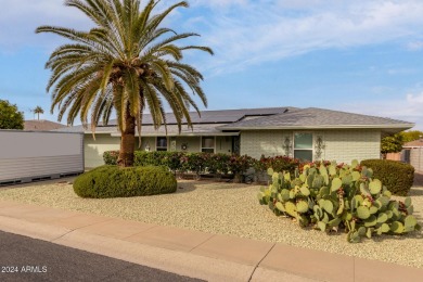 Energy-efficient home in Sun City showcases a large front yard on Sun City Riverview Golf Course in Arizona - for sale on GolfHomes.com, golf home, golf lot