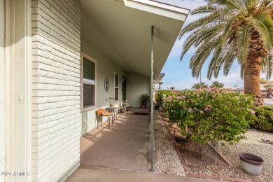 Energy-efficient home in Sun City showcases a large front yard on Sun City Riverview Golf Course in Arizona - for sale on GolfHomes.com, golf home, golf lot