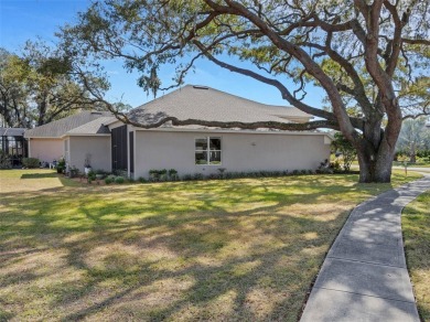 Fall in love with this beautifully updated two-story residence on Ridgewood Lakes Golf and Country Club in Florida - for sale on GolfHomes.com, golf home, golf lot