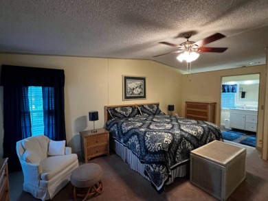 This beautifully maintained 2-bedroom, 2-bathroom Homes of Merit on Lake Henry Golf Club in Florida - for sale on GolfHomes.com, golf home, golf lot