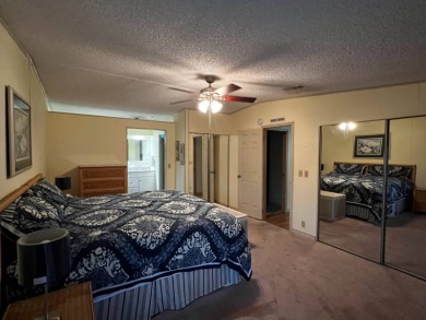 This beautifully maintained 2-bedroom, 2-bathroom Homes of Merit on Lake Henry Golf Club in Florida - for sale on GolfHomes.com, golf home, golf lot