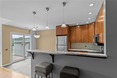 Don't miss out on this updated condo overlooking the peaceful on Louisquisset Golf Club in Rhode Island - for sale on GolfHomes.com, golf home, golf lot