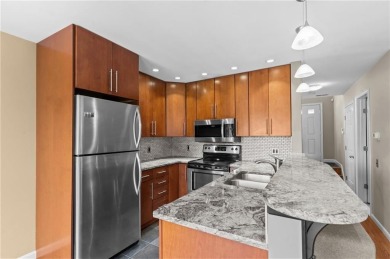 Don't miss out on this updated condo overlooking the peaceful on Louisquisset Golf Club in Rhode Island - for sale on GolfHomes.com, golf home, golf lot