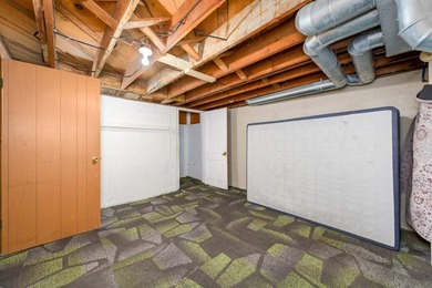 Welcome home to this charming 3-bedroom home with a spacious on L W Clapp Memorial Golf Course in Kansas - for sale on GolfHomes.com, golf home, golf lot