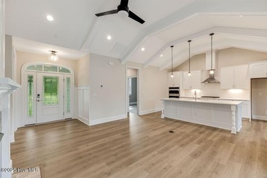 This brand new Riptide home with stunning setting and finishes on Sea Trail Golf Resort in North Carolina - for sale on GolfHomes.com, golf home, golf lot