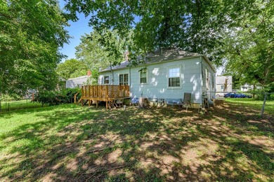 Welcome home to this charming 3-bedroom home with a spacious on L W Clapp Memorial Golf Course in Kansas - for sale on GolfHomes.com, golf home, golf lot