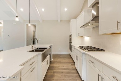 This brand new Riptide home with stunning setting and finishes on Sea Trail Golf Resort in North Carolina - for sale on GolfHomes.com, golf home, golf lot