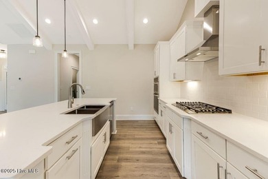 This brand new Riptide home with stunning setting and finishes on Sea Trail Golf Resort in North Carolina - for sale on GolfHomes.com, golf home, golf lot