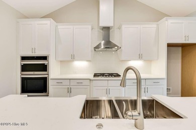 This brand new Riptide home with stunning setting and finishes on Sea Trail Golf Resort in North Carolina - for sale on GolfHomes.com, golf home, golf lot