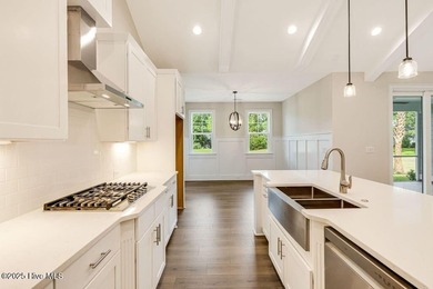 This brand new Riptide home with stunning setting and finishes on Sea Trail Golf Resort in North Carolina - for sale on GolfHomes.com, golf home, golf lot