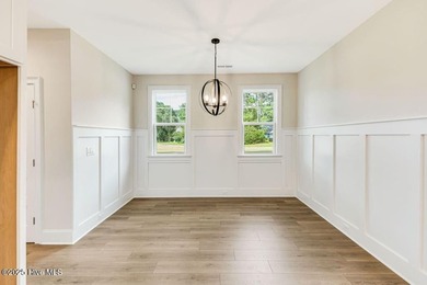 This brand new Riptide home with stunning setting and finishes on Sea Trail Golf Resort in North Carolina - for sale on GolfHomes.com, golf home, golf lot