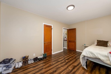 Welcome home to this charming 3-bedroom home with a spacious on L W Clapp Memorial Golf Course in Kansas - for sale on GolfHomes.com, golf home, golf lot