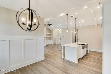 This brand new Riptide home with stunning setting and finishes on Sea Trail Golf Resort in North Carolina - for sale on GolfHomes.com, golf home, golf lot